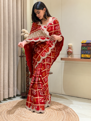 "Red Bandhani Garchola saree with scalloped embroidered border by Pratibha Sarees"