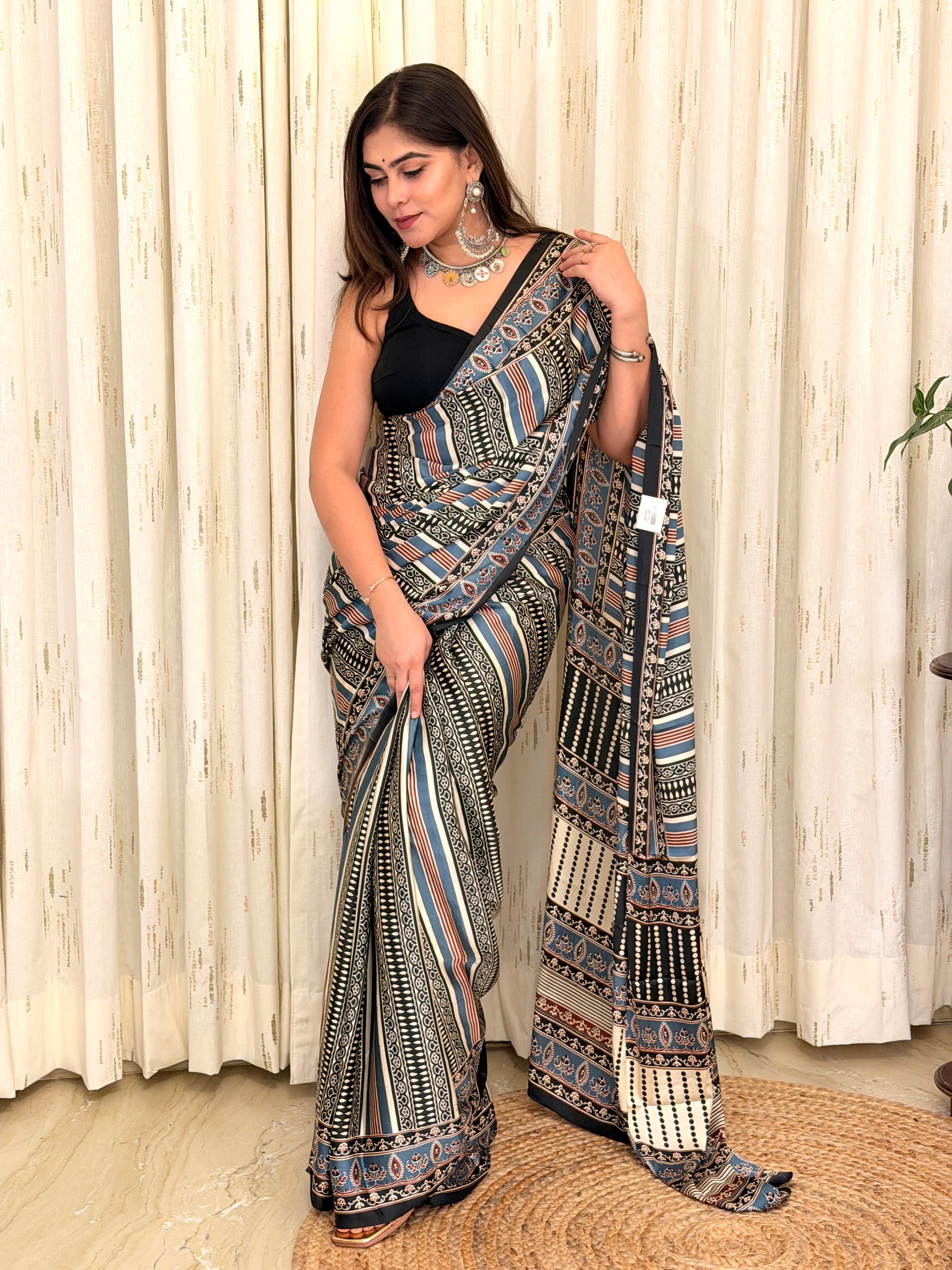 Blue and black Ajrakh striped modal silk saree draped on model - full front view