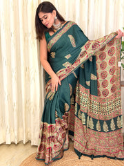Woman in green Ajrakh saree with ivory medallion pallu - draped front view