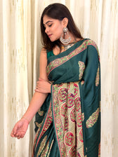 Close-up of green leaf booti print saree with Ajrakh border detail