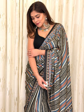 Close-up of blue black rust diagonal stripe Ajrakh print saree fabric