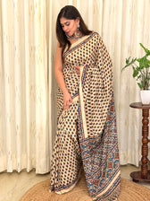 Ivory paisley print modal silk saree with Ajrakh border draped on model - side view