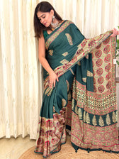Woman in green Ajrakh saree with ivory medallion pallu - draped front view