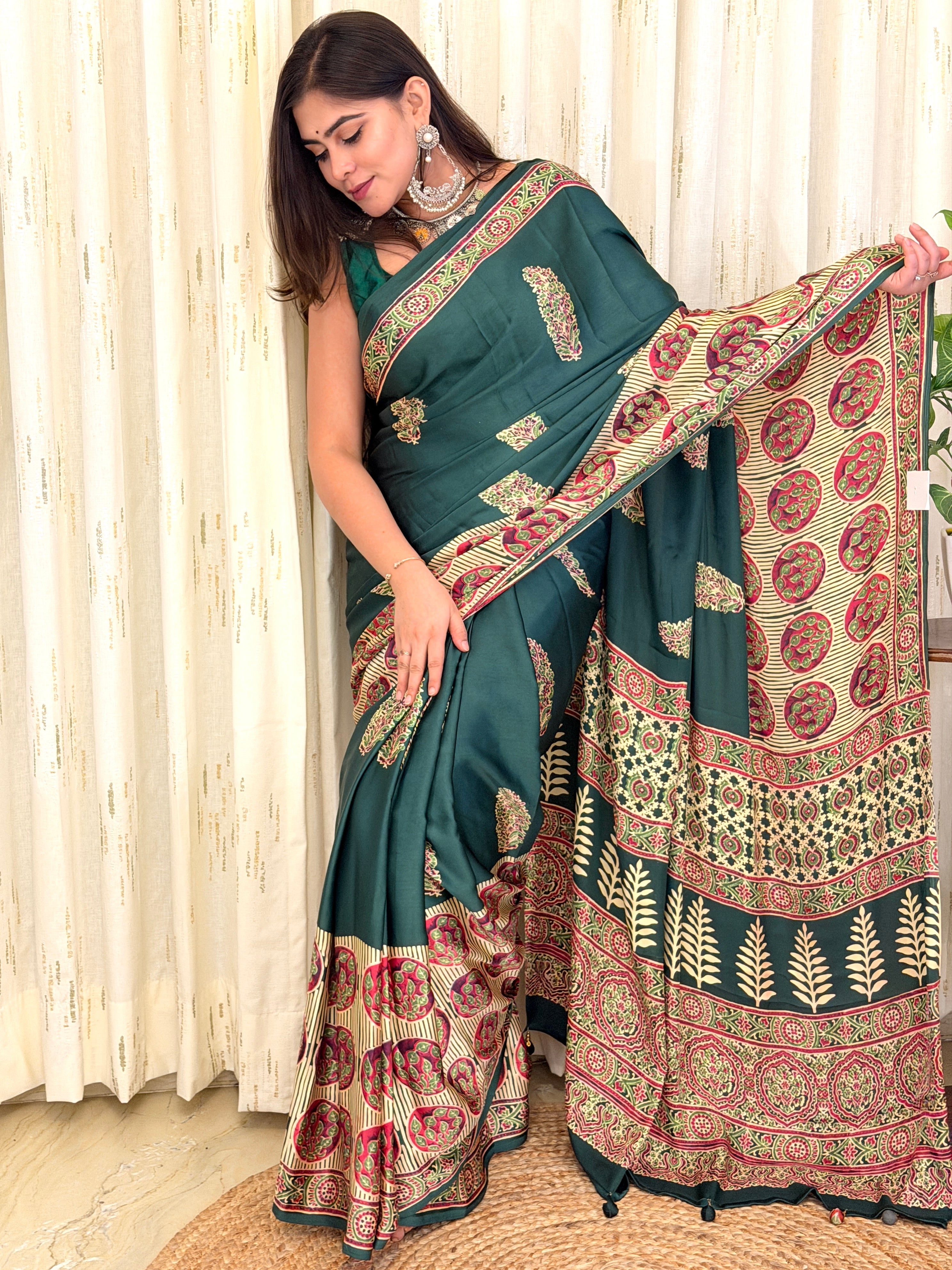 Woman in green Ajrakh saree with ivory medallion pallu - draped front view