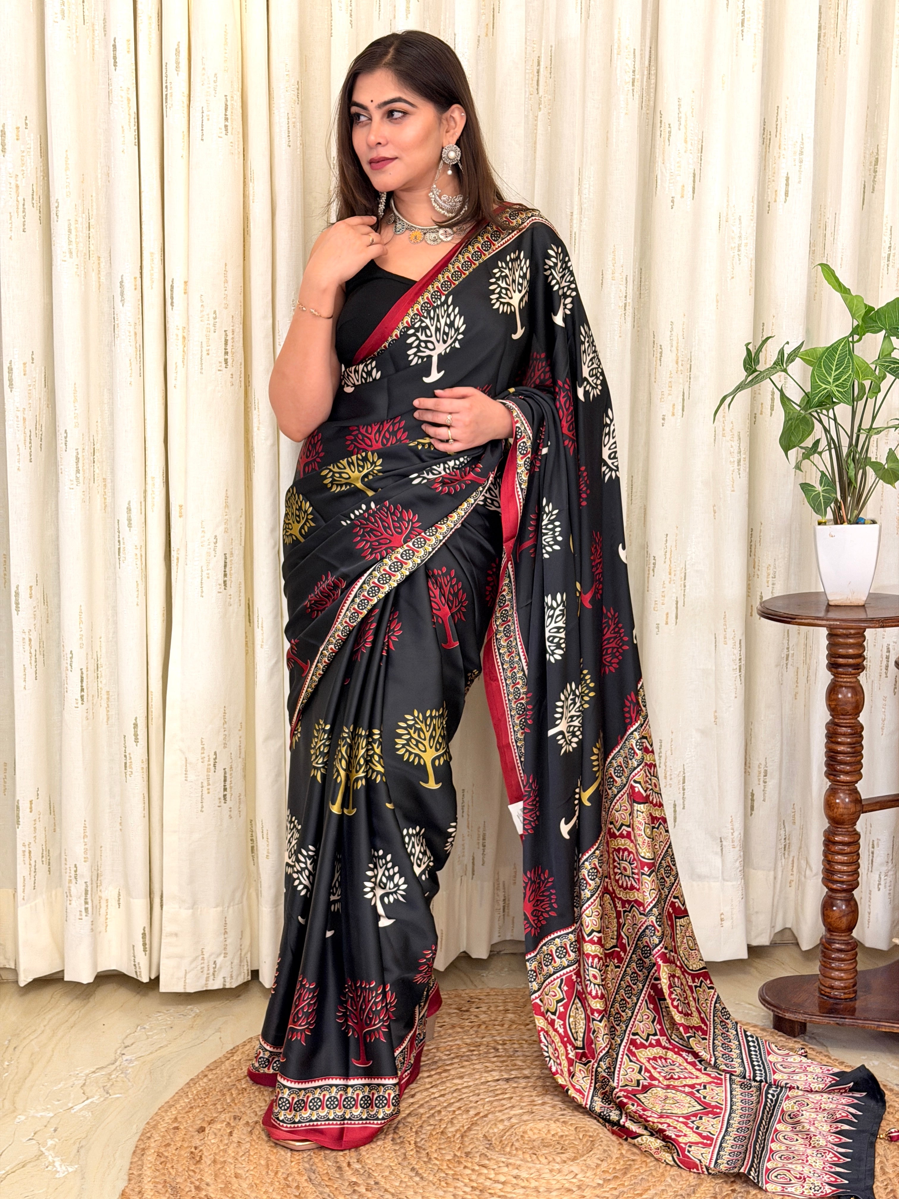 Black modal silk saree with Tree of Life print and maroon Ajrakh border - full drape front view