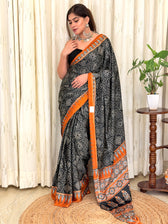 Black bandhani mandala print modal silk saree with rust Ajrakh border - full drape front view