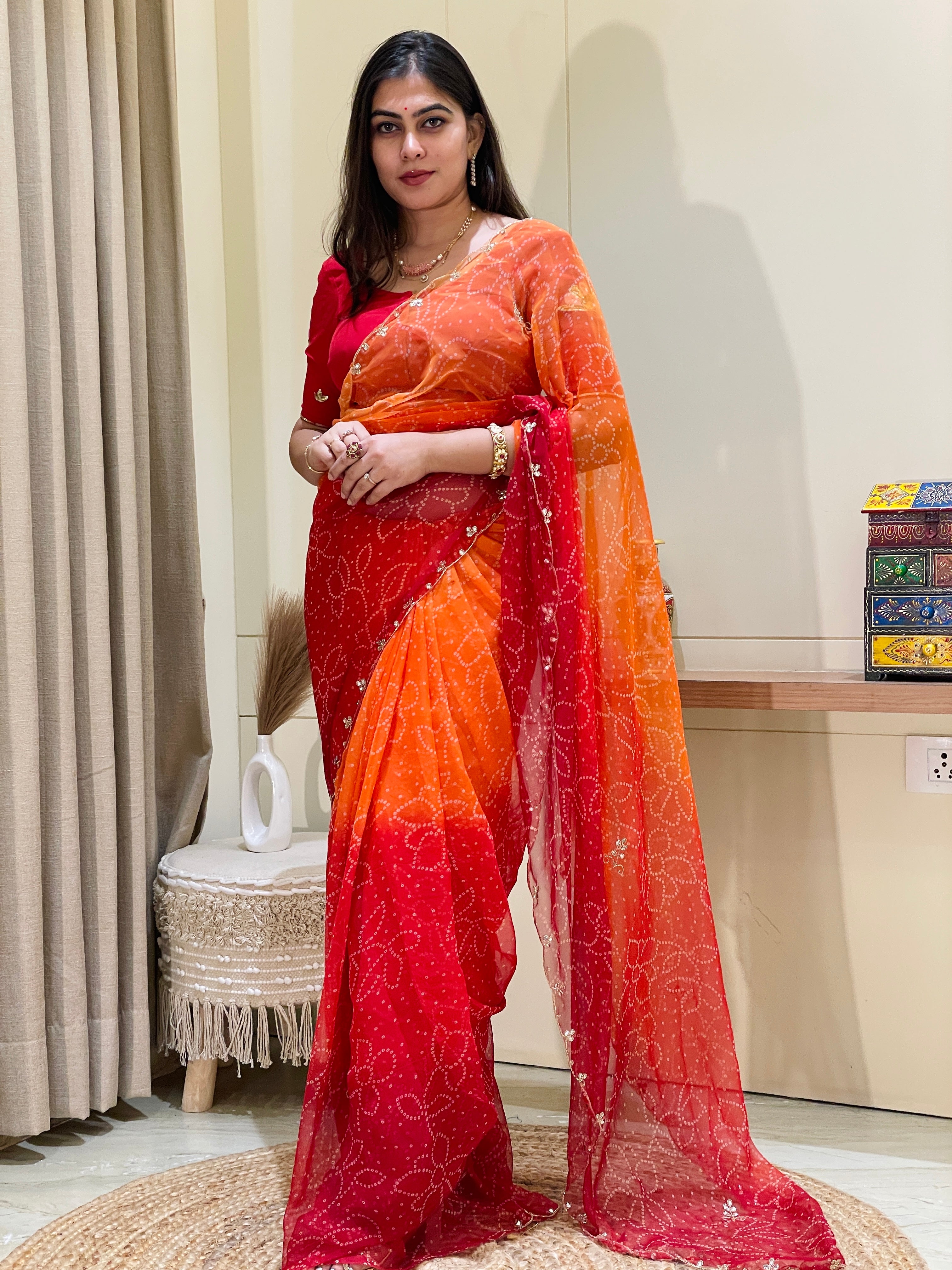 Trisha Red & Orange Georgette Saree
