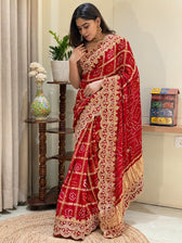 "Red Bandhani Garchola saree featuring heavy scalloped embroidery and gold tissue pallu by Pratibha Sarees."