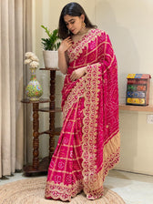 "Rani pink Bandhani Garchola saree featuring heavy scalloped embroidery and gold tissue pallu by Pratibha Sarees."