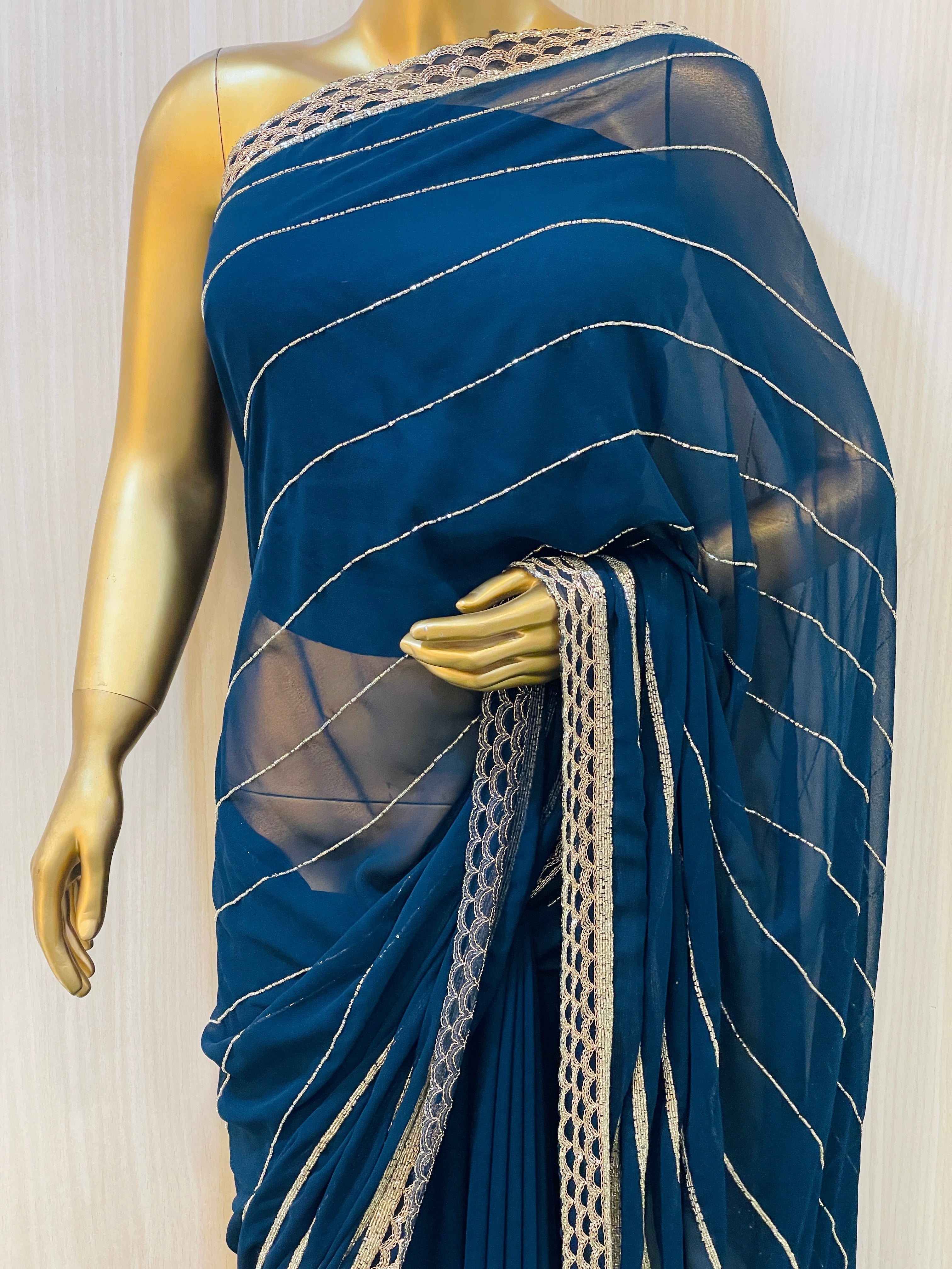 Vinisha Blue Georgette Saree